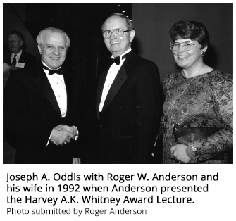 Joseph A. Oddis with Roger W. Anderson and his wife in 1992 when Anderson presented the Harvey A.K. Whitney Award Lecture.