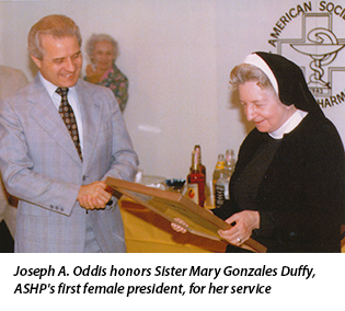 Joseph A. Oddis honors Sister Mary Gonzales Duffy, ASHP's first female president, for her service